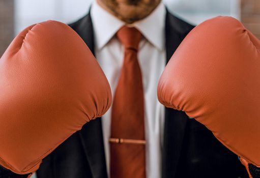 close up.businessman in Boxing gloves.concept of competitiveness