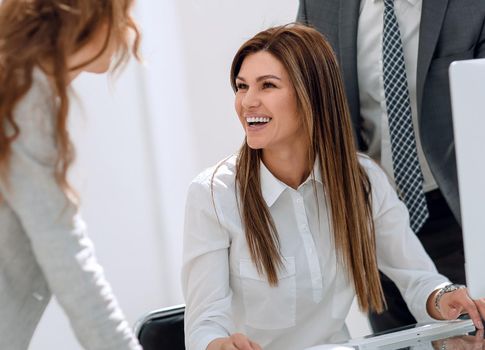 smiling business colleagues in the workplace.office weekdays