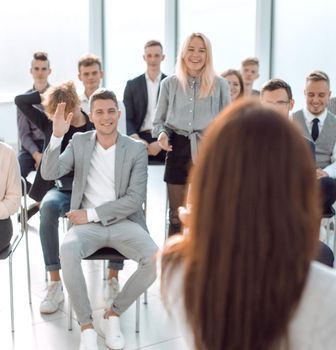 rear view. businesswoman asks questions to the audience during the seminar. photo with copy space