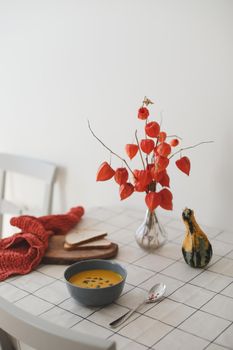 Hot healthy vegetarian pumpkin cream soup with seeds