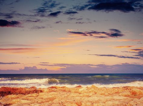 Fantastic view of the nature reserve Monte Cofano. Dramatic scene. Sunset over sea. Location cape San Vito. Sicilia, Italy, Europe. Mediterranean and Tyrrhenian sea.