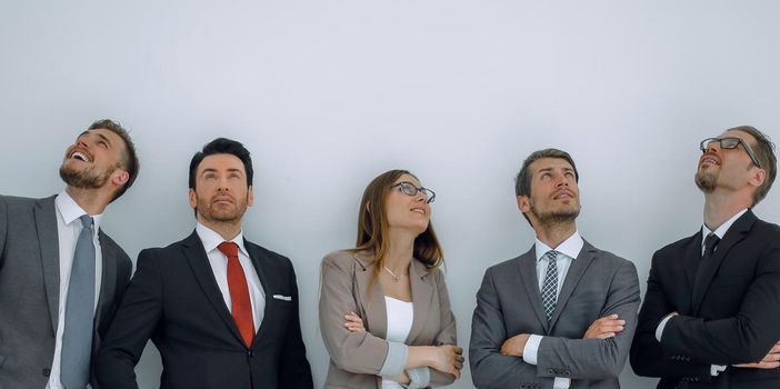 Happy positive business group looking up with dreaming expression.photo with copy space