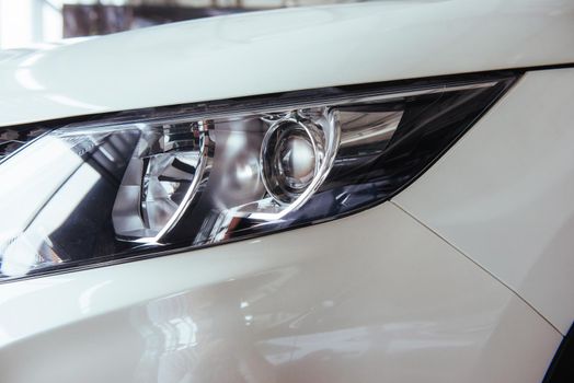Headlights and hood of sport car. Exhibition