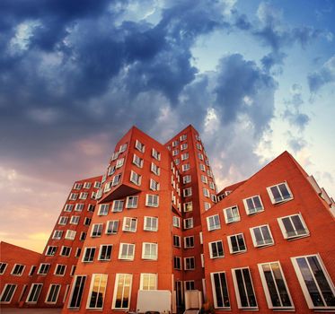 The new block of modern flats and blue sky in the background