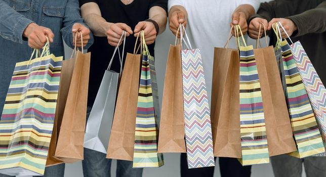 close up.group of students with shopping bags .shopping and lifestyle