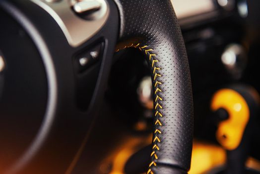 Modern car interior dashboard and steering wheel.