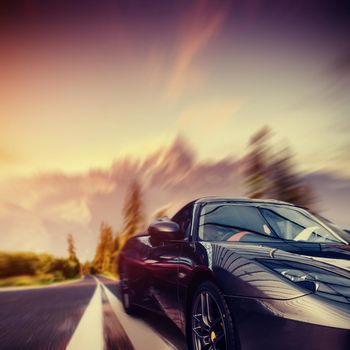 vintage retro car on the road. Car at high speed. Natural blurred background. Soft light effect.