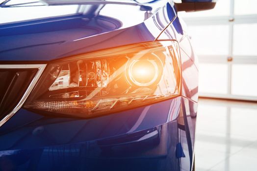 The headlights and hood Blue sports car