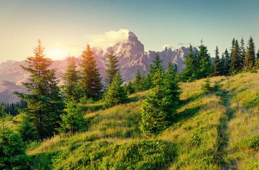Colorful sky at sunset in the mountains. Fantastic cumulus clouds. Carpathians. Ukraine. Europe
