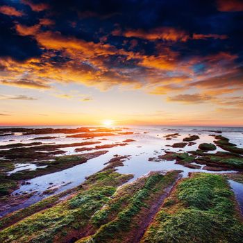 Fantastic view of the nature reserve Monte Cofano. Dramatic scene. Sunset over sea. Location cape San Vito. Sicilia, Italy, Europe. Mediterranean and Tyrrhenian sea.