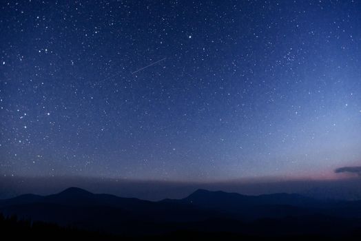 fantastic winter meteor shower and the snow-capped mountains