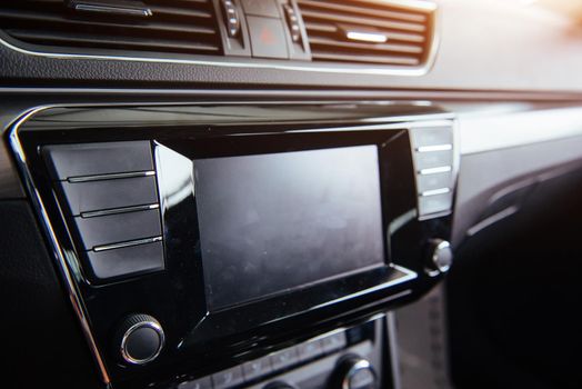 Car audio system front panel. of beautiful modern car close up in the cabin.