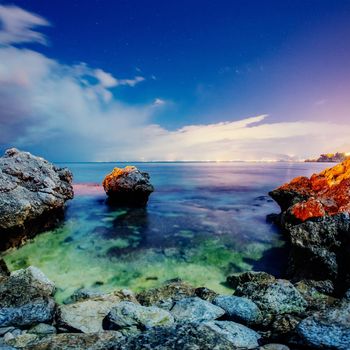 Fantastic view of the nature reserve Monte Cofano. Dramatic scene. Sunset over sea. Location cape San Vito. Sicilia, Italy, Europe. Mediterranean and Tyrrhenian sea.