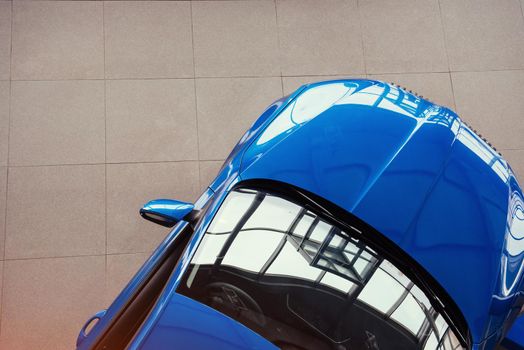 The headlights and the hood of a sports car.