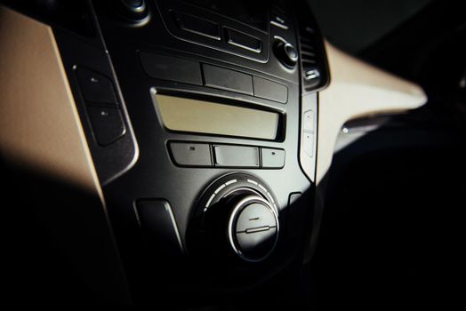 Modern car interior dashboard and steering wheel.