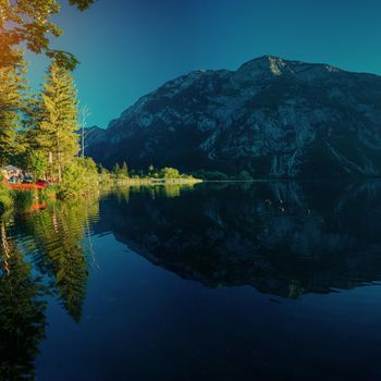 Mountain lake between by mountains. Seaside villa Italy