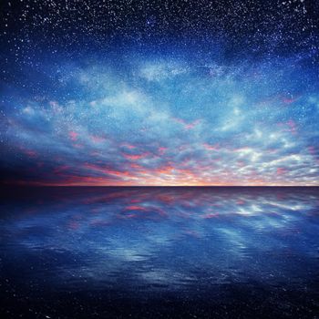 Fantastic starry sky over the sea. Beauty world