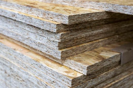 a stack of chipboard in a hardware store. wooden usb sheet. Sale of wooden building materials, repair