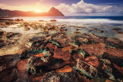 Fantastic view of the nature reserve Monte Cofano. Dramatic scene. Sunset over sea. Location cape San Vito. Sicilia, Italy, Europe. Mediterranean and Tyrrhenian sea.