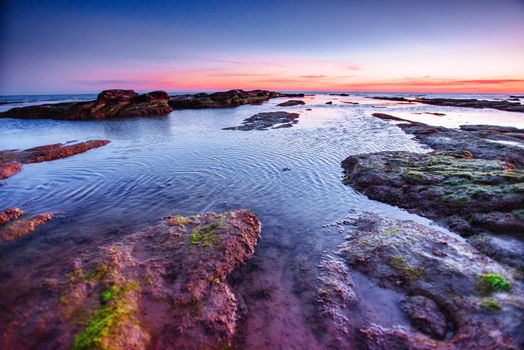 Fantastic view of the nature reserve Monte Cofano. Dramatic scene. Sunset over sea. Location cape San Vito. Sicilia, Italy, Europe. Mediterranean and Tyrrhenian sea.