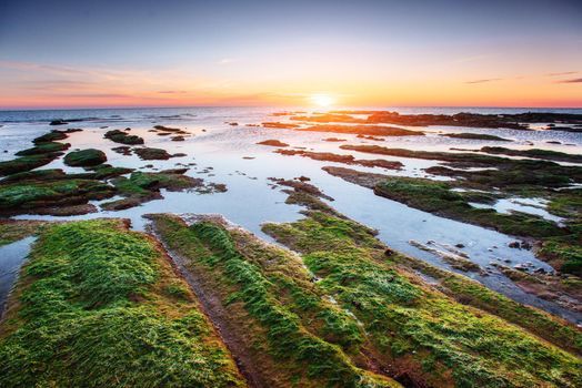 Fantastic view of the nature reserve Monte Cofano. Dramatic scene. Sunset over sea. Location cape San Vito. Sicilia, Italy, Europe. Mediterranean and Tyrrhenian sea.