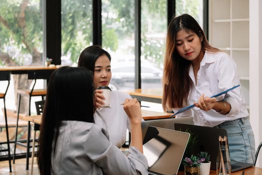 Group of young asian people in smart casual wear discussing business office, Business Team Corporate Organization Meeting Concept