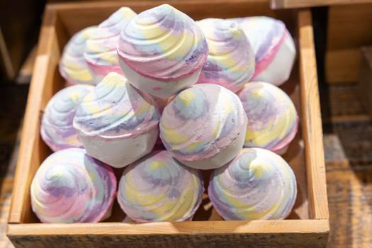 Colorful beautiful handmade Aromatic bath Bombs in a Wooden box.