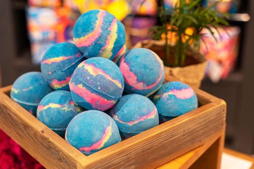 Colorful beautiful handmade Aromatic bath Bombs in a Wooden box.