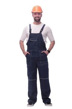 in full growth. confident man in overalls . isolated on white background