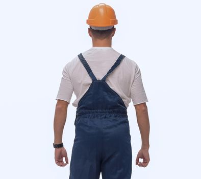 rear view. a man in a work suit looking at a copy of the space . isolated on white background