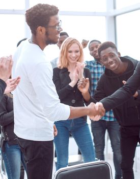 group of happy young people applauding their leaders. the concept of success