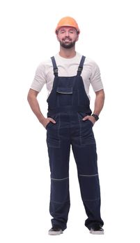 in full growth. confident man in overalls . isolated on white background