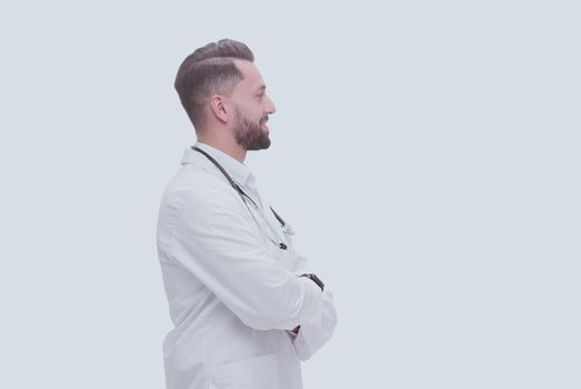 side view. smiling medical doctor looking at copy space .isolated on white background