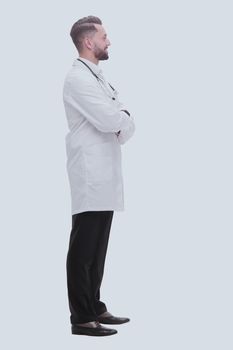 side view. smiling medical doctor looking at copy space .isolated on white background