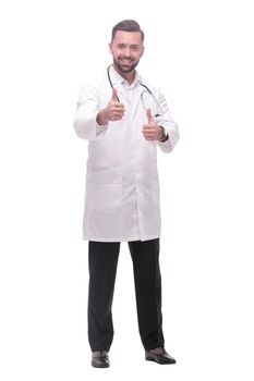 in full growth. smiling medical professional showing thumbs up .isolated on white background