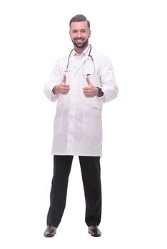 in full growth. smiling medical professional showing thumbs up .isolated on white background