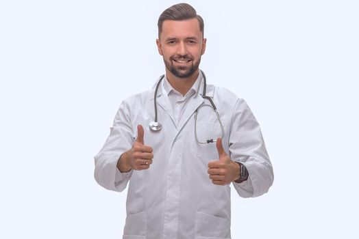 in full growth. smiling medical professional showing thumbs up .isolated on white background