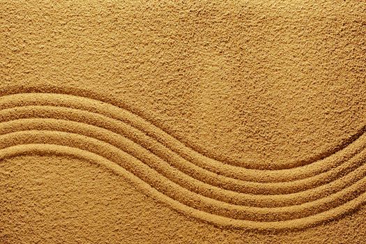 The texture of the sand in summer with smooth lines for meditation or calmness and relaxation.