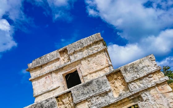 Ancient Tulum ruins Mayan site with temple ruins pyramids and artifacts in the tropical natural jungle forest palm and seascape panorama view in Tulum Mexico.