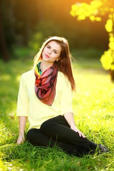 Attractive young woman enjoying her time outside in park