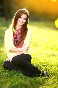 Portrait of beautiful young woman with sunny day