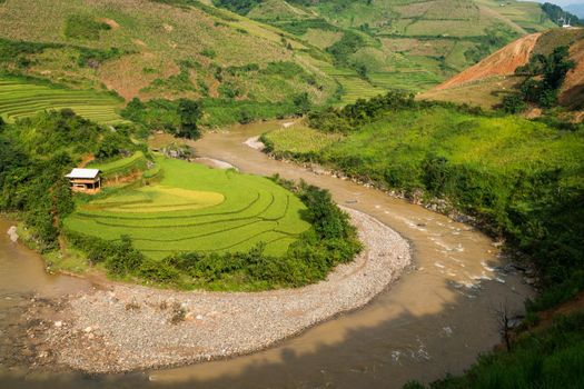 Terraced rice field landscape near Sapa in Vietnam. Mu Cang Chai Rice Terrace Fields stretching across the mountainside, layer by layer reaching up as endless, with about 2,200 hectares of rice terraces, of which 500 hectares of terraces of 3 communes such as La Pan Tan, Che Cu Nha and Ze Xu Phinh.