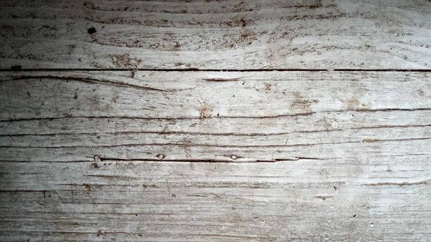 Old wooden textured background. Vintage white wooden board with cracks.