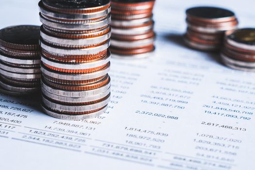 Pile of gold coins stack in finance treasury deposit bank account for saving . Concept of corporate business economy and financial growth by investment in valuable asset to gain cash revenue profit .