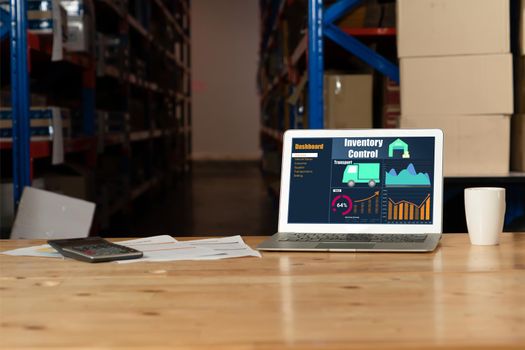 Warehouse management software application in computer for real time monitoring of goods package delivery . PC screen showing smart inventory dashboard for storage and supply chain distribution .