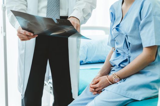 Doctor in professional uniform examining patient at hospital or medical clinic. Health care , medical and doctor staff service concept.