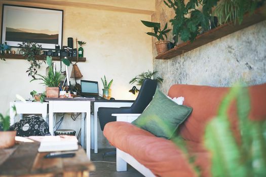 Still life shot of a workstation in the living room of a rustic apartment