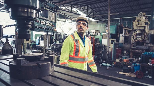 Smart factory worker using machine in factory workshop . Industry and engineering concept.