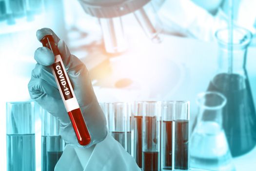 Coronavirus COVID-19 medical test vaccine research and development concept. Scientist in laboratory study and analyze scientific sample of Coronavirus antibody to produce drug treatment for COVID-19.