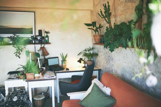 Still life shot of a workstation in the living room of a rustic apartment